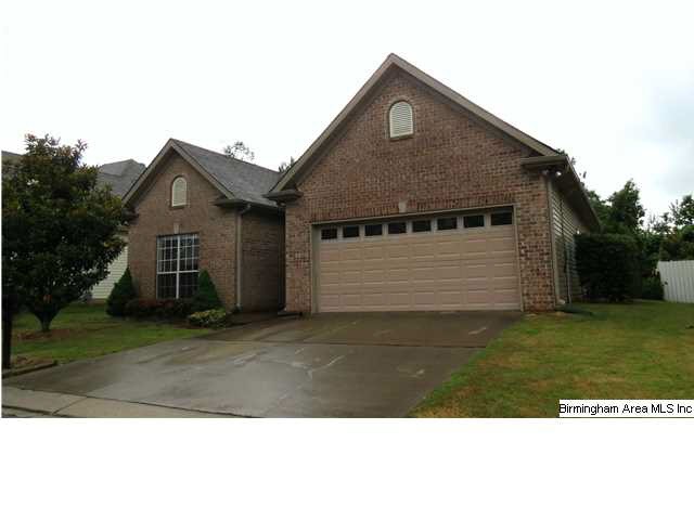 Low maintenance brick/vinyl exterior.