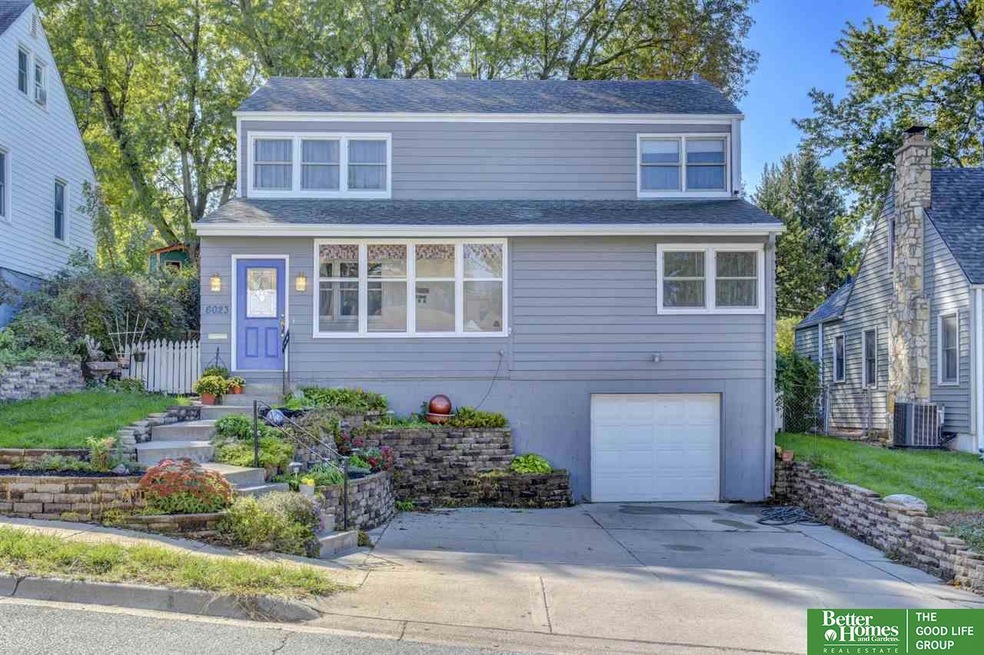 Bright open 1.5 Story in popular Aksarben area. 4 large bed, 2 bath, 1 car (extra deep/wide) heated.  Hot tub! Original wood floors. New metal wrapped windows and ext paint 2018. Home Warranty included