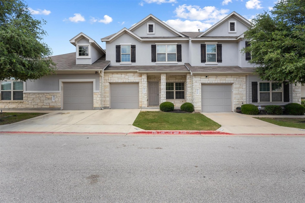 Multi unit property with stone siding, driveway, 