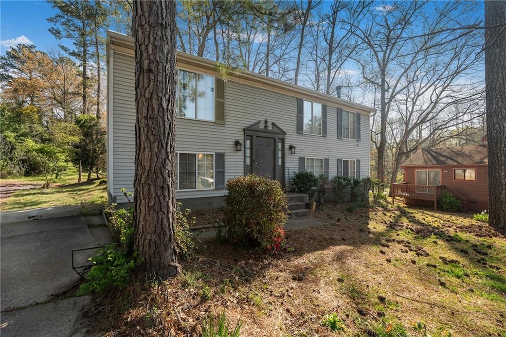 Split foyer home with a wooden deck