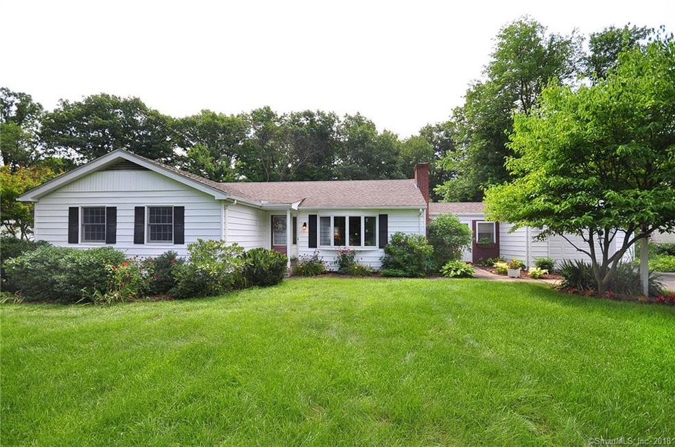 Light and bright and airy L-shaped ranch. Just a c
