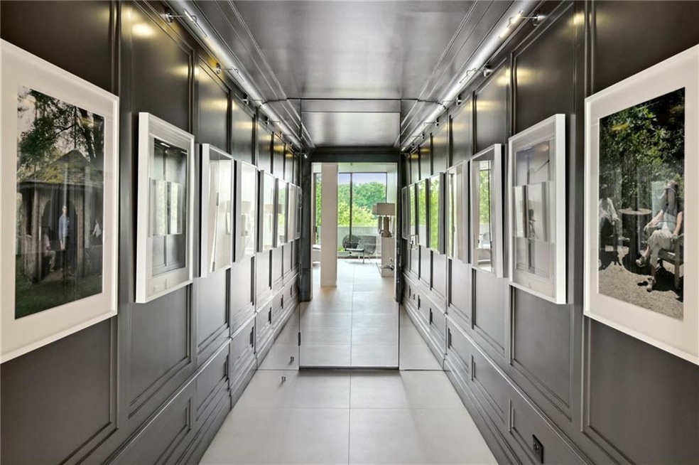 Dramatic Entrance Hall features custom lighting
