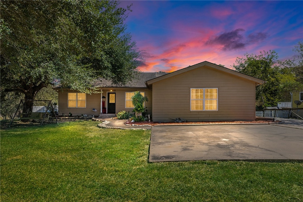 Ranch-style house with a front lawn