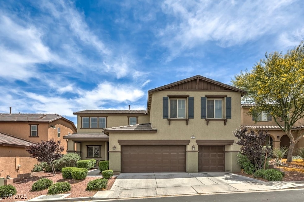 View of front of home with stucco siding, a garage