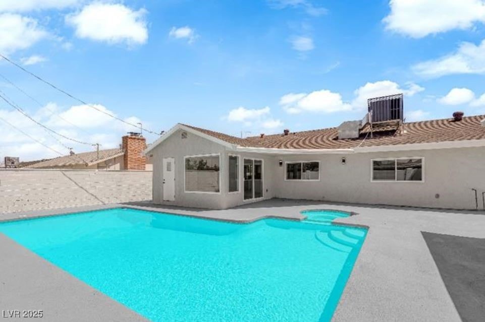 View of swimming pool featuring a patio and a pool