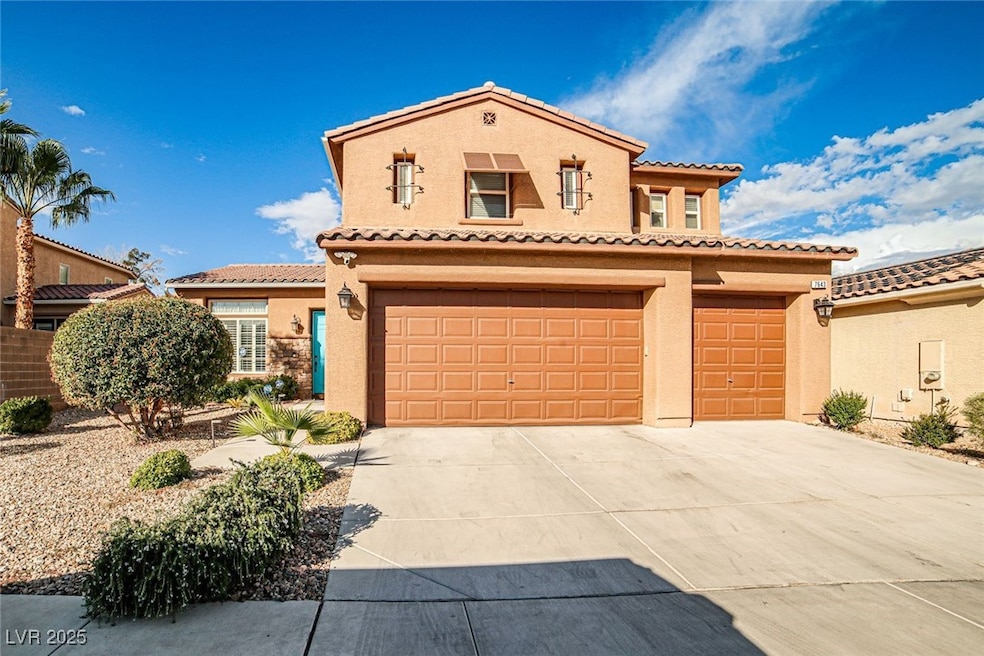 Mediterranean / spanish-style house featuring stucco siding, driveway, a garage, and a tiled roof