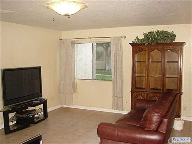 Large Living Area with Updated Ceramic Tile and Co