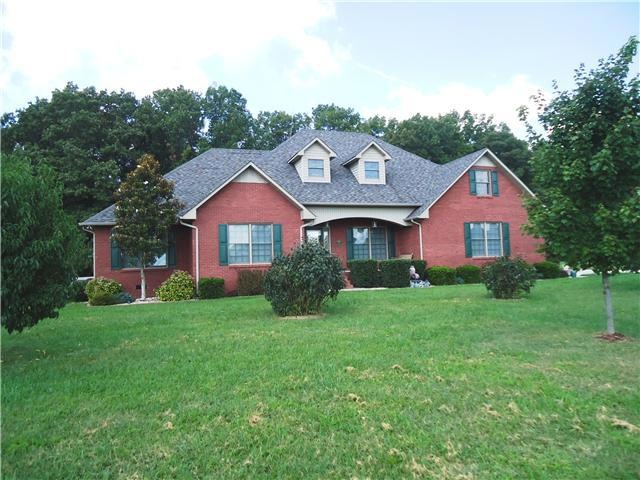 This beautiful English Country home is located on a large lot with a private backyard bordered by mature trees.