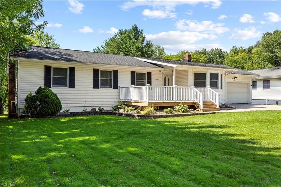 Single story home with garage and a front yard