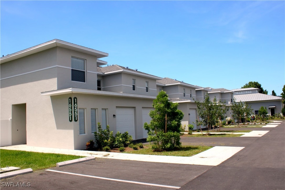 View of front of property with stucco siding and u