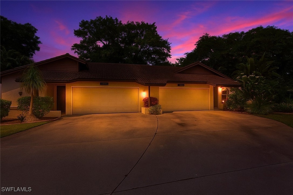 View of front facade featuring concrete driveway,