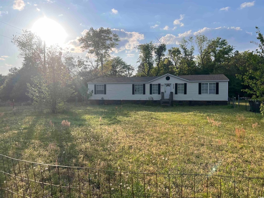 Manufactured / mobile home with a front yard, crawl space, and entry steps