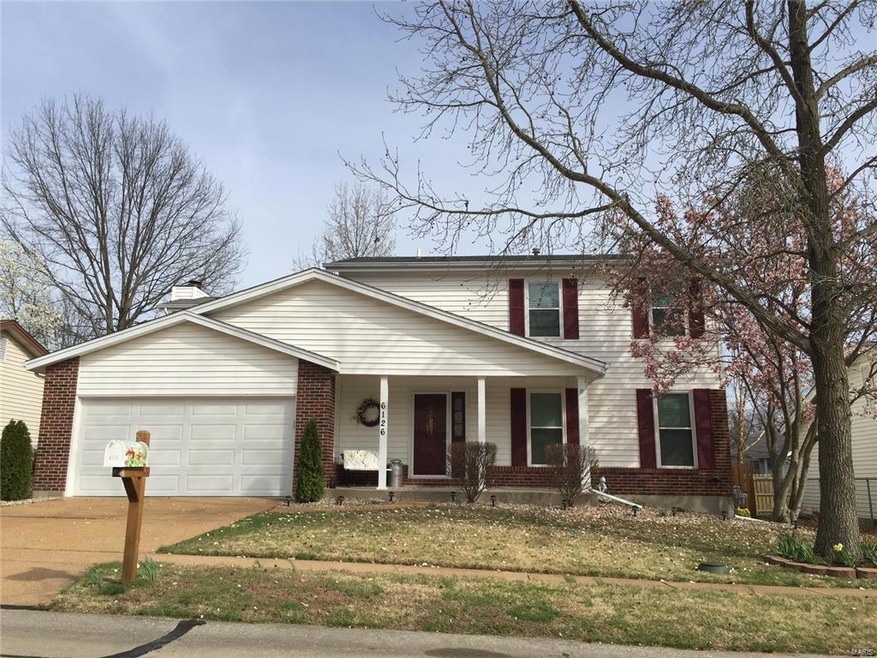 Welcome into this lovely well maintained home with beautiful blooming magnolia and spring flowers!