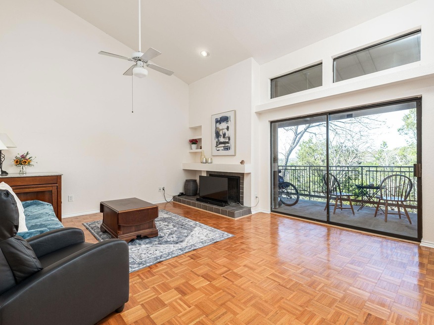 Living room with built in shelves, high vaulted c