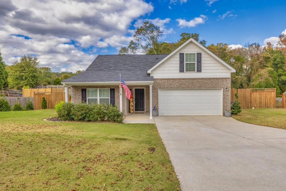View of front of property with a front lawn and a 