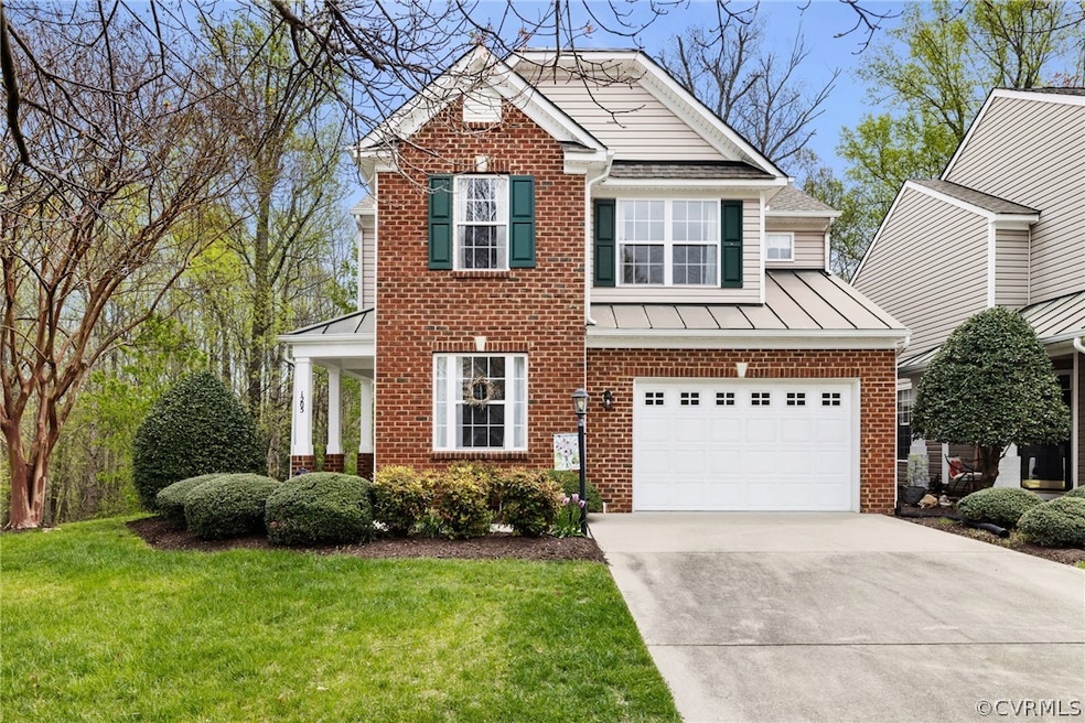 Paved driveway, two-car garage, and mature, mainte