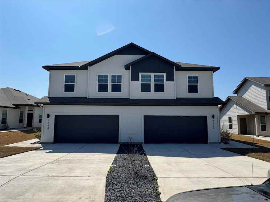 View of front facade featuring an attached garage
