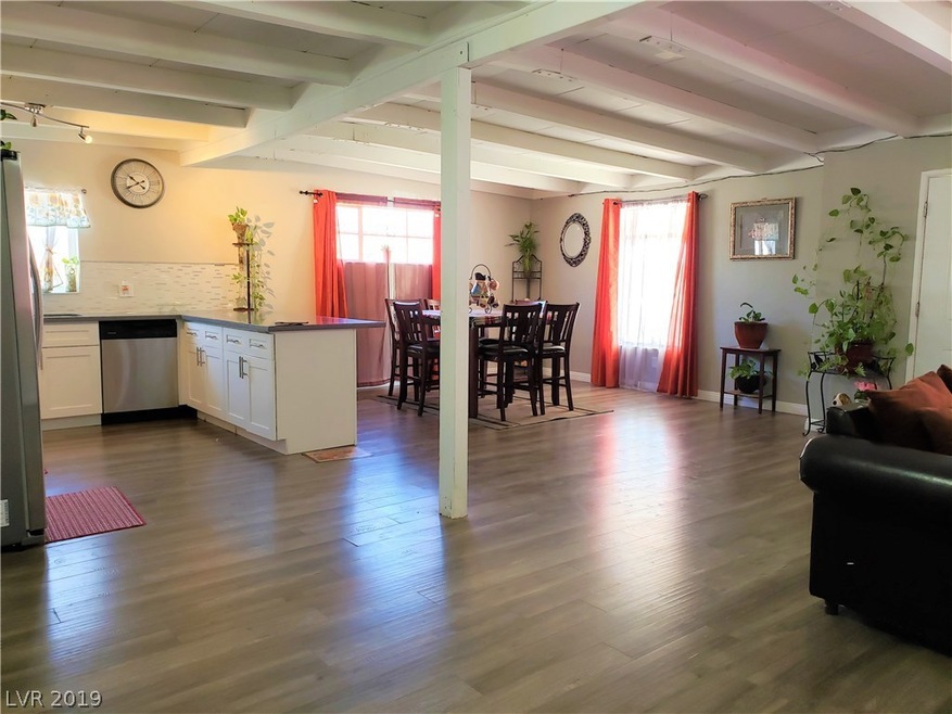 Beautiful open floor plan with open beam ceiling g