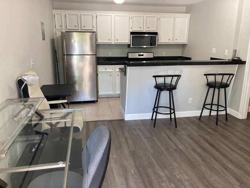 Kitchen featuring stainless steel appliances, whi