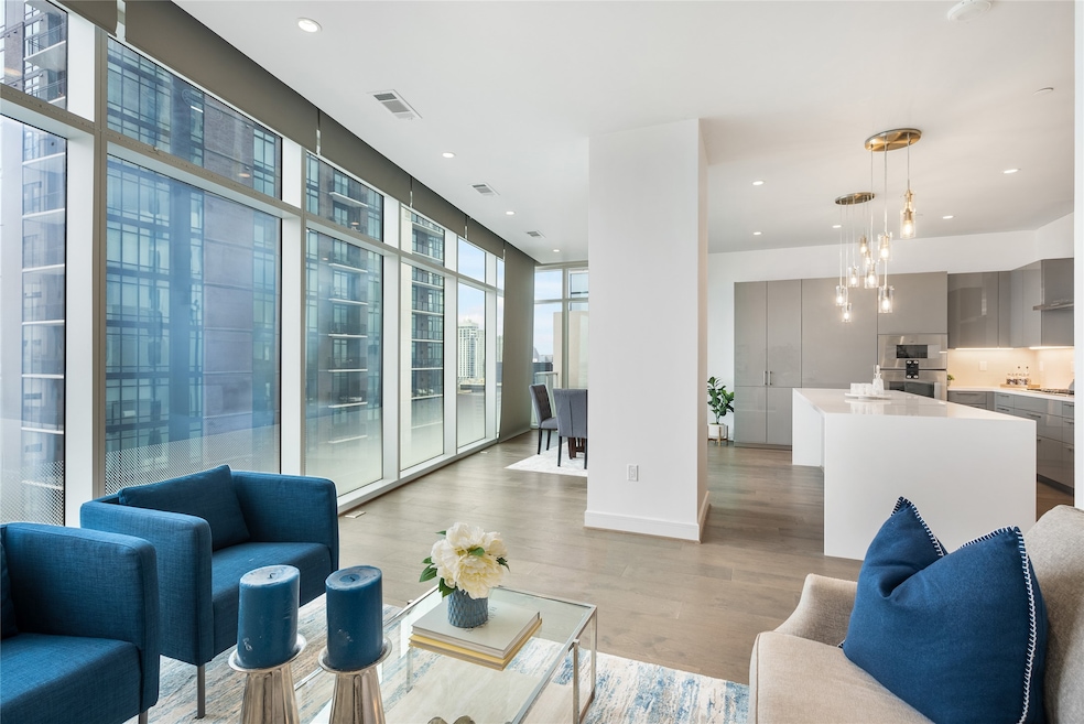 Welcome to the Arabella unit 1704, a stunningly modern high rise condo, walking distance from the River Oaks District!