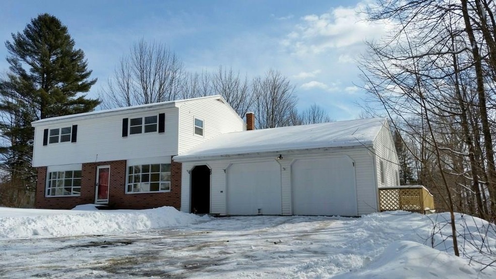 Front of home. Snow is covering...