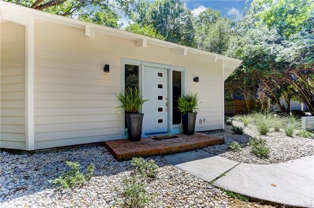 Extensive exterior landscaping, low plantings, and