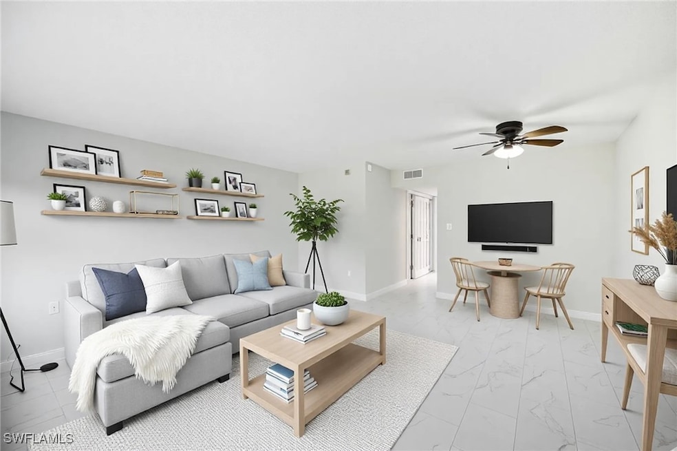Living room with tile floor and baseboards