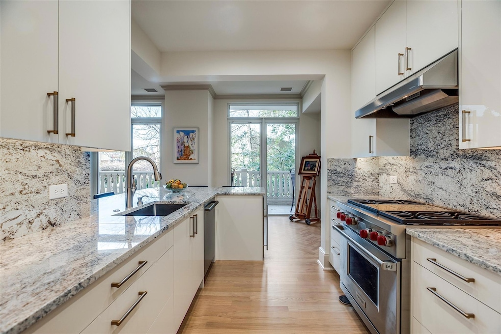 Gourmet kitchen with breakfast bar and tree-top vi