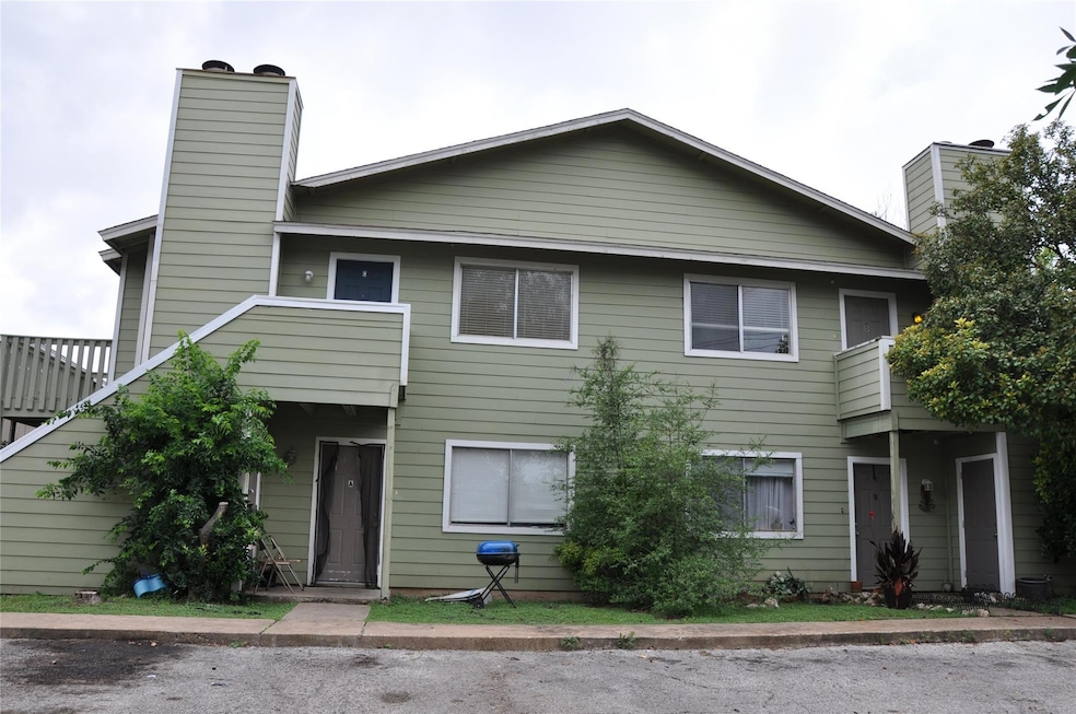 Townhome / multi-family property featuring a chim