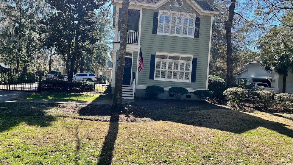 View of side of property with a lawn