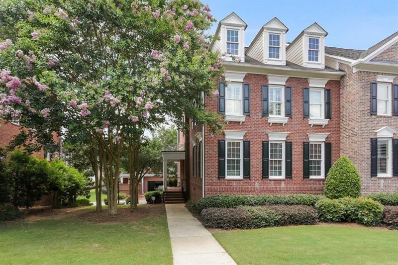 Your stately end unit townhouse awaits on this qui