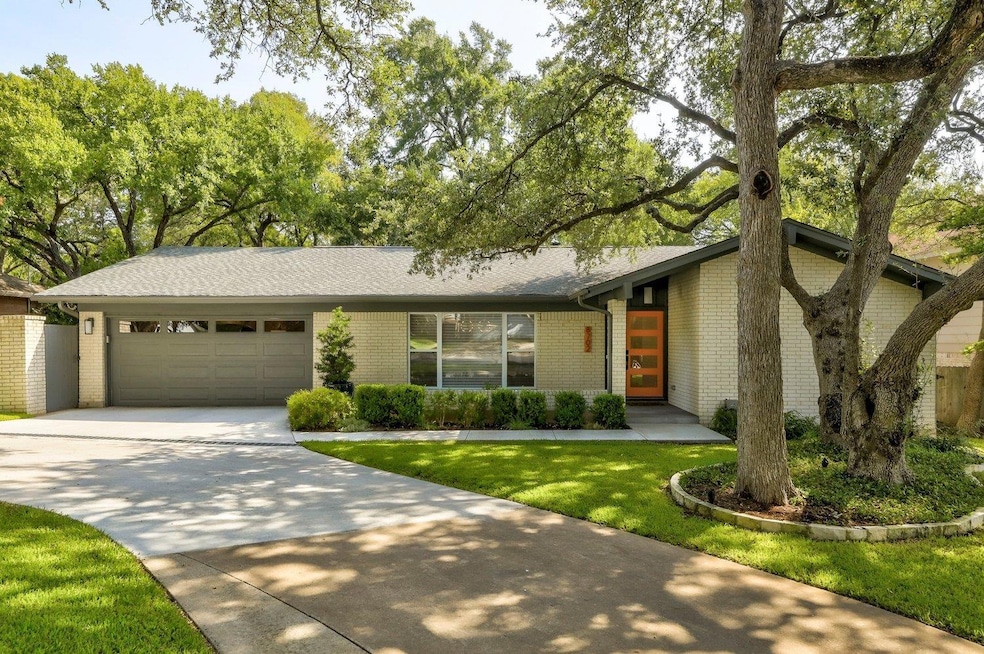 Mid-century home featuring an attached garage, co