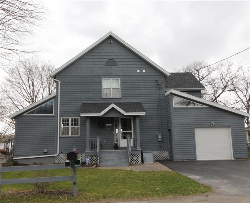 Road side view of home with attached garage