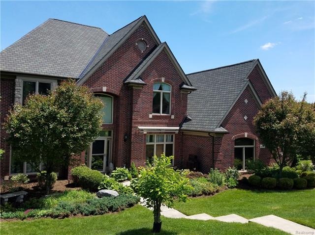 Well crafted 3 story walkout lake front home on Ot