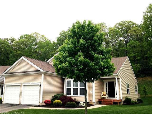 Exterior Front. A beautifully landscaped walkway e