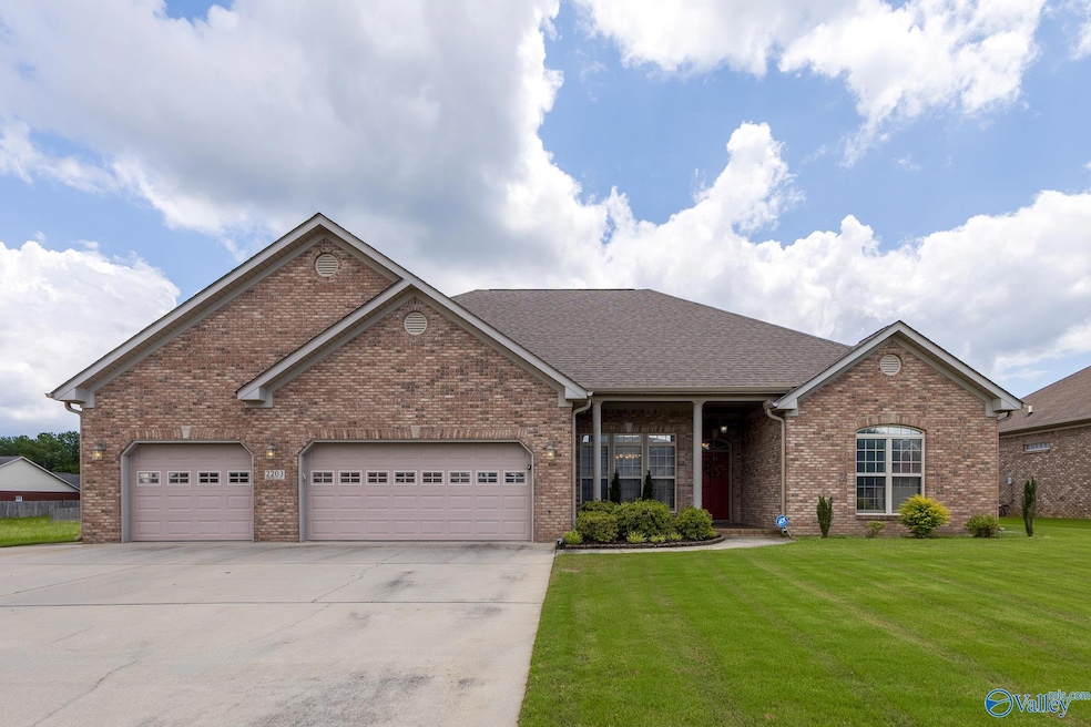 Brick home with 3 car garage.