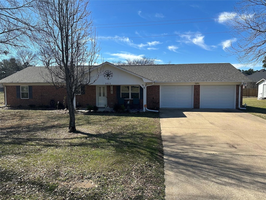 Ranch-style home with an attached garage, brick si