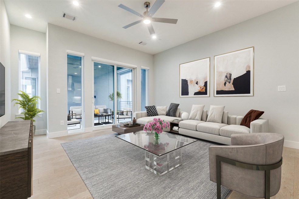 Living room with light wood-style flooring, recessed lighting, and a ceiling fan