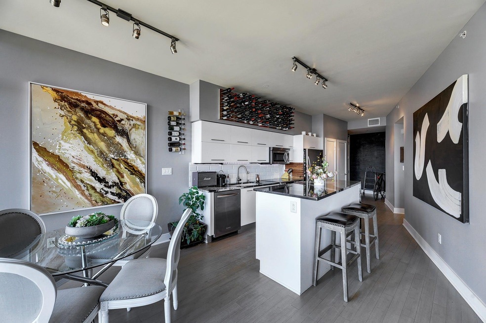 Kitchen featuring track lighting, stainless steel