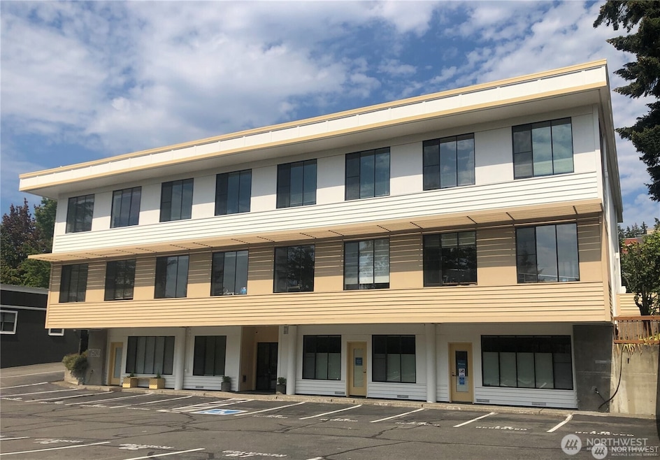 South facing back side of the Solarmarine Building. Suite 103 is to the right of the lower floor lobby entrance.