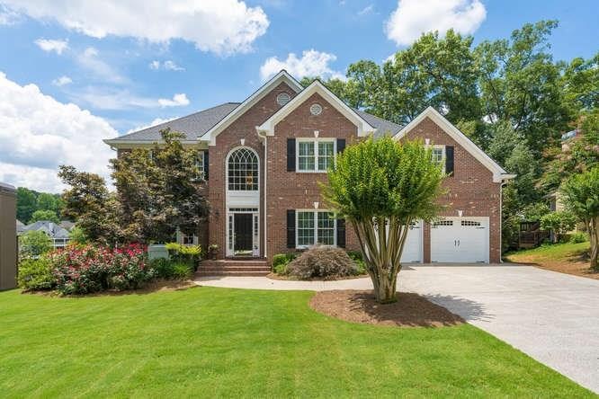 4 sided brick beauty situated on a gorgeous lake l