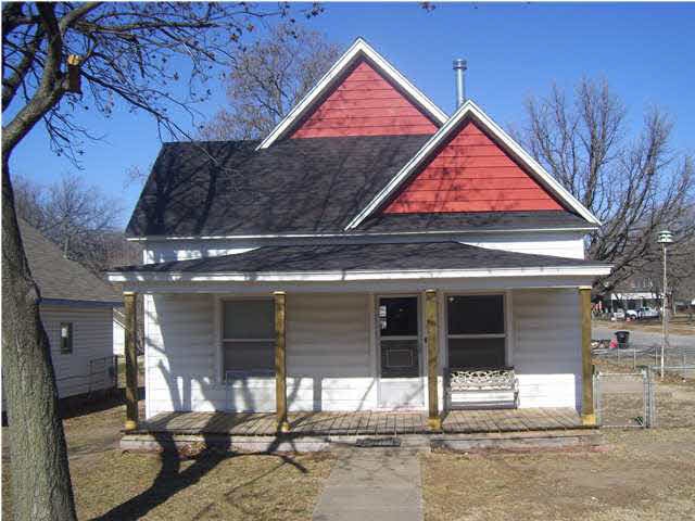Nice corner house with covered porch.