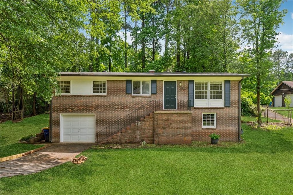 Single story home featuring an attached garage, co