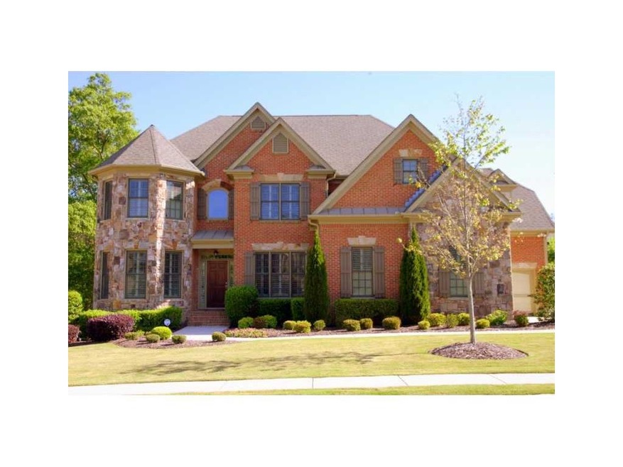 Exterior Front. Brick and stone exterior - three c