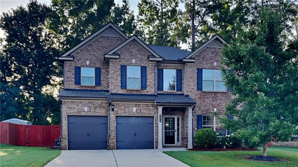 View of front of home featuring a garage and a fro