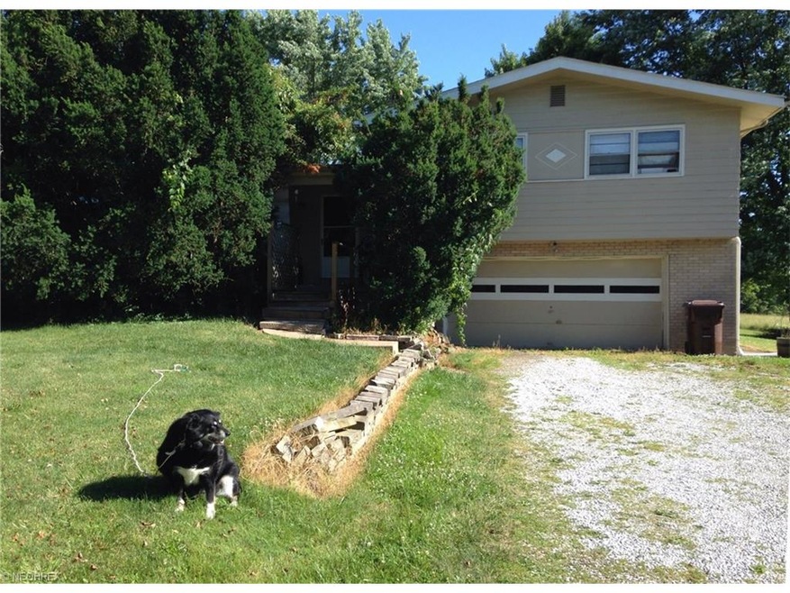This 4-level split with 2-car garage sits a distan