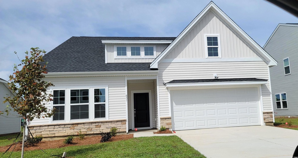View of front of home featuring a front yard and a