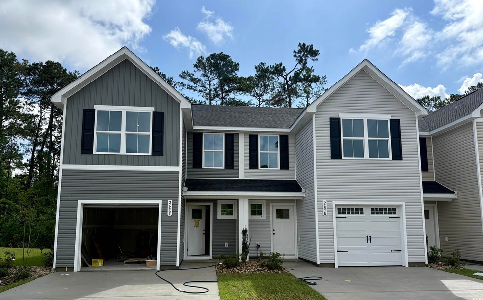 View of front of property with concrete driveway, 