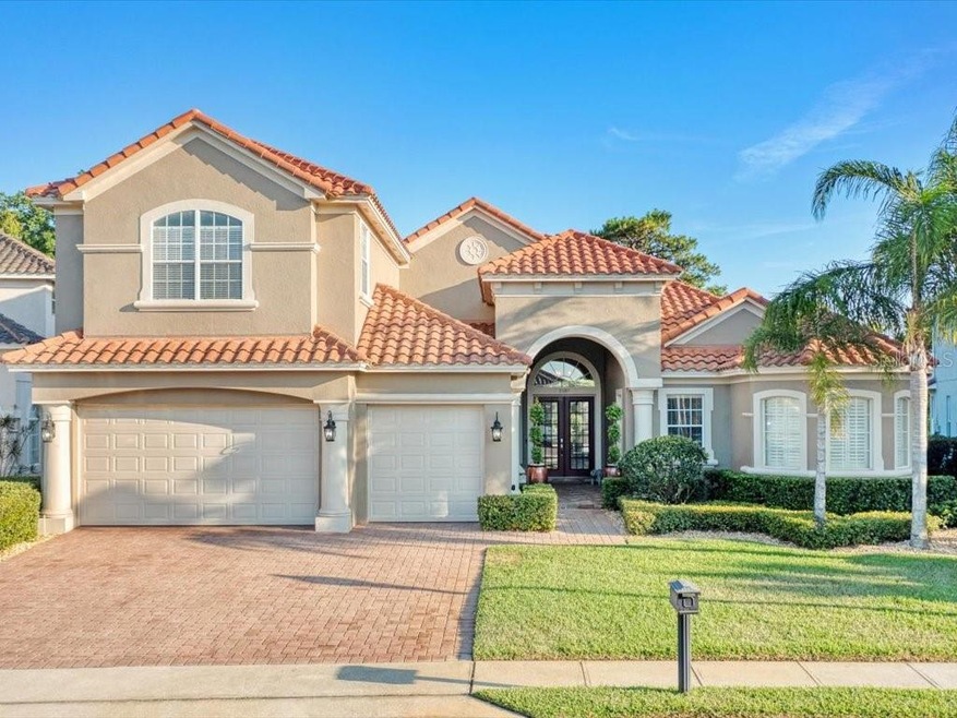 Beautiful exterior with tile roof; 3 car garage; b
