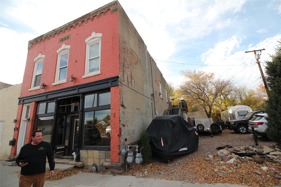 View of side of property featuring brick siding
